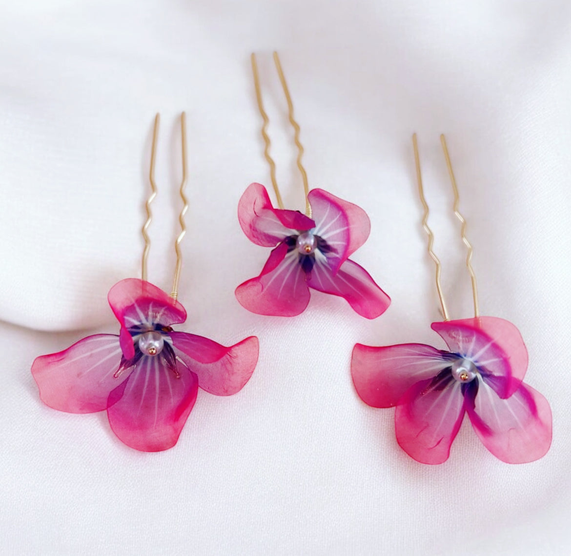 Bright pink and purple flower hair pins